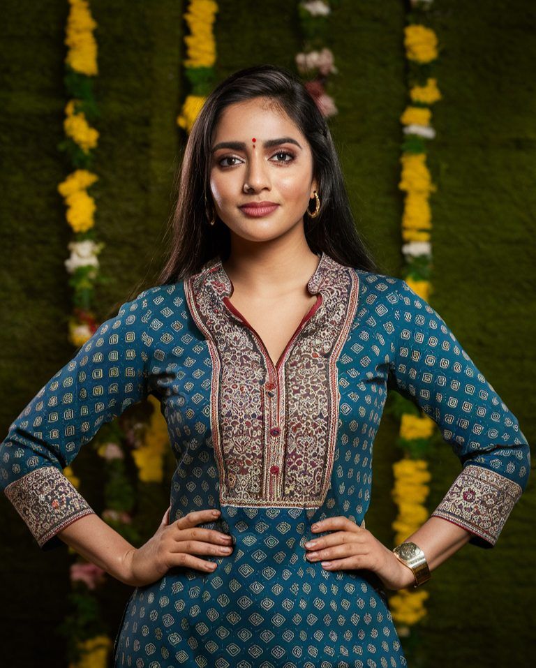 Woman in a teal printed kurti